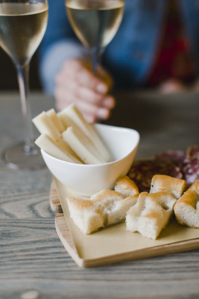Wine, focaccia & cheese in Manarola, Cinque Terre | Photo by Melissa Schollaert