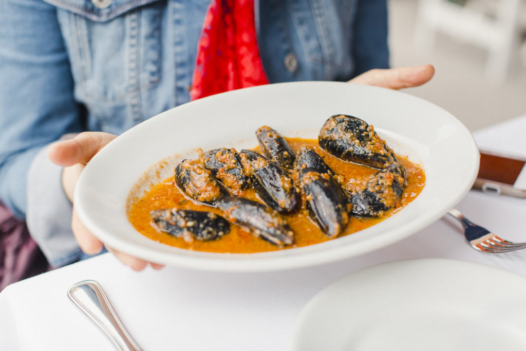 How to learn Italian while cooking | Muscoli ripieni (Stuffed mussels) in Cinque Terre, Liguria, Italy | Photo by Melissa Schollaert